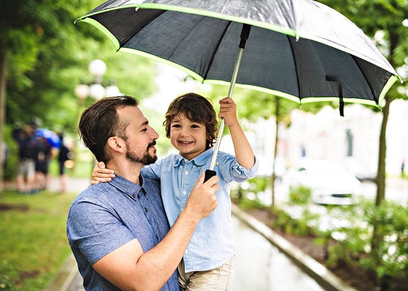 Evergreen NW Insurance Man and Son with Umbrella
